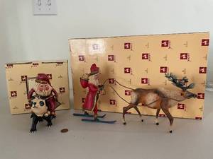 lot 879 image: Bill Jauquet Americana Collection Reindeer Pulling Santa and Santa on Panda Figurines