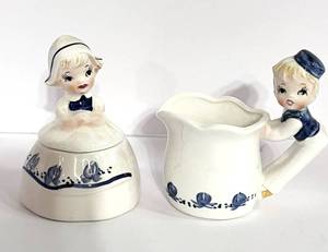 lot 63 image: Antique  Dutch Boy and Girl Cream and Sugar by Adriane