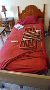 lot 30 image: Hospital Bed with a Sleep Number Mattrass on it. Headboard and Hospital Table included