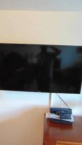 lot 76 image: Samsung TV with Wall Mount, Zvox Sound Bar and Impecca DVD PLayer