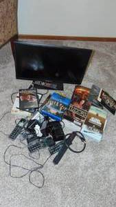 lot 81 image: Small TV, DVDs, Phones and Books