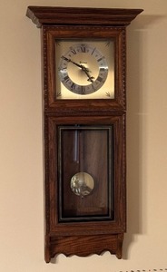 lot 38 image: Bulova Antique Style Wall Clock with Wooden Frame