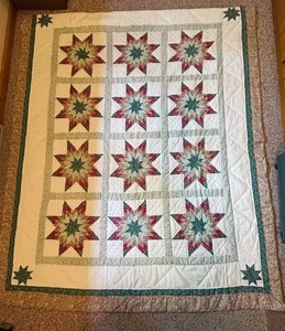 lot 75 image: Vintage Hand-Sewn Eight-Point Star Quilt