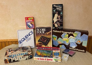 lot 243 image: Oodles of Games including Sequence, Score Four, National Geographic Global Pursuit, Probe and More