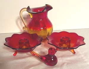 lot 340 image: Vintage Fenton Glass Ruby 9 Petal Candle Holders, Amberina Glass Pitcher and Amberina Glass Bird
