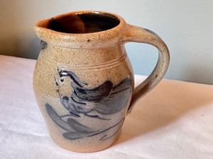 lot 219 image: 1987 Rowe Pottery Works Handcrafted Pitcher with Blue Design