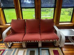 lot 27 image: Outdoor Patio Sofa and Matching Glass-Top Side Table Set