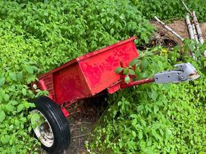 lot 95 image: Used Red Metal Utility Trailer with Wheels