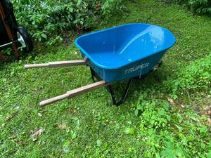 lot 96 image: Truper Blue Steel Wheelbarrow with Wooden Handles