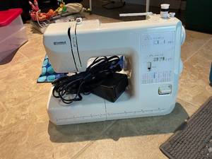 lot 230 image: Kenmore Sewing Machine with Foot Pedal and Stitches Chart