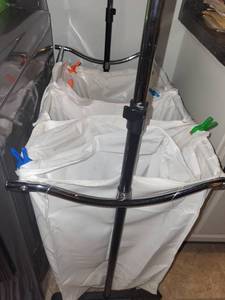 lot 288 image: Metal Rolling Laundry Hamper with Hangers and Clothespins