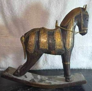 lot 34 image: Antique hand-carved rocking horse, likely of Indonesian origin