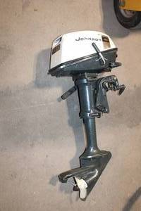 lot A-97 image: Johnson Outboard Motor with Throttle and Gear Controls