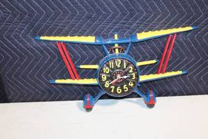 lot 188 image: Vintage Biplane Metal Wall Clock
