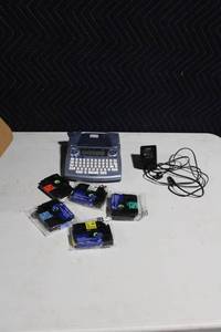 lot 195 image: Brother P-Touch Label Maker with Power Adapter and 5 Label Tapes