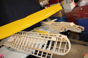lot 254 image: Partially Assembled Model Airplane Kit with Yellow Wing