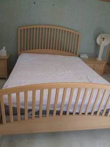 lot 34 image: Light tone wood Queen size bedframe...