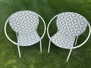 lot 134 image: Pair of Like New Geometric Pattern Woven Patio Chairs