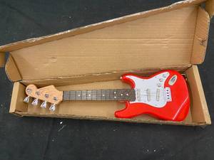 lot 105 image: 214 - Red Electric Toy Guitar with Box