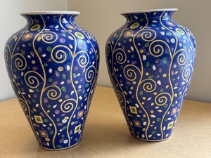 lot 41 image: Set of 2 Decorative Porcelain Vases with Vibrant Swirl Design