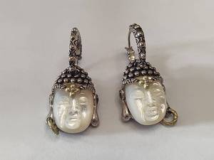 lot 14 image: Barbara Bixby 18K & Sterling Carved Mother of Pearl Buddha Earrings