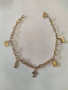 lot 19 image: 10K Religious Charm Bracelet