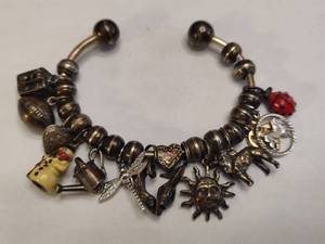 lot 117 image: Silver Bracelet with Numerous Charms