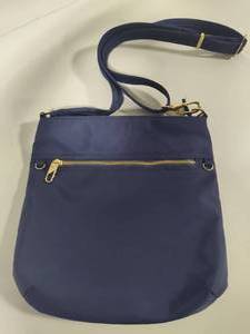 lot 127 image: Travelon Cross Body Vinyl Travel Bag