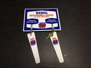 lot 106 image: Rebel Gas - PorcelainEnamel Restroom Sign wKeys