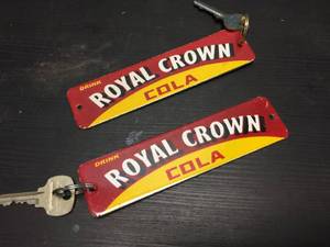 lot 209 image: Vintage Royal Crown Cola - Porcelain Crate TagRestroom Keys