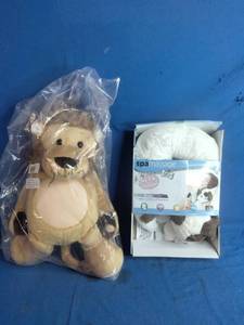 lot 50 image: Health Touch Neck Massager with a dog design, featuring relaxing vibration and a Lion Stuffed Animal - Unused