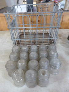 lot 127 image: 18 Vintage Insulators in Metal Wire Milk Crate