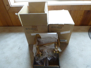 lot 155 image: 12 Brizo Brass Toilet Paper Holders