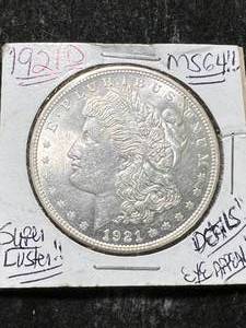 lot 15 image: 1921-D US MORGAN SILVER DOLLAR MS64