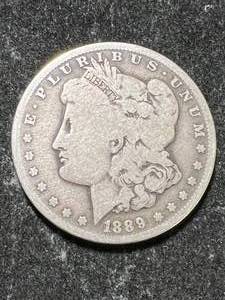 lot 24 image: 1889-O US MORGAN SILVER DOLLAR