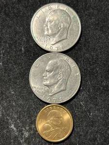 lot 42 image: 2 US IKE DOLLARS WITH SACAGAWEA DOLLAR