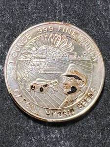 lot 80 image: 1 TROY OZ .999 FINE SILVER CARGILL SEEDS ROUND