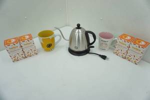 lot 246 image: Electric Tea Pot, Organic Immunity Boost Tea, and 2 Ceramic Mugs
