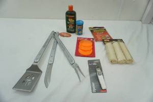 lot 305 image: Dog Treats, Dog Shampoo, Outdoor Grilling Tools, Can Opener, & Fish Food