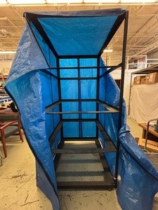 lot 28 image: Heavy-Duty Rolling Rack w Cover  Built to Last Durable welded steel frame with a tough powder-coated finish. Rolls smoothly on carpet, vinyl, wood, or concrete with 2 fixed and 2 swivel casters. Includes dust cover. Great for storage and transport