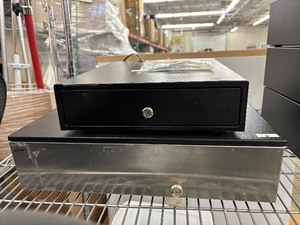 lot 48 image: Two space-saving cash drawers in different sizes. Flip-top lids for tight counter spaces, built-in compartments for organized storage of coins and bills. Great for retail, pop-ups, and mobile vending setups.