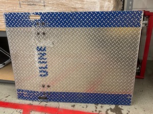 lot 53 image: MSRP $500 Uline H-1833 Dock Plate 36x48 -1,764 lb Capacity Heavy-duty aluminum plate bridges the gap between trucks & docks for safe, easy loading. Portable design with built-in handles & diamond plate surface for added traction & durability