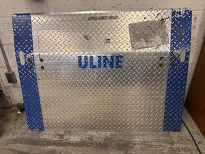 lot 54 image: MSRP $500 Uline H-1215 Aluminum Dock Plate 48x36  4,383 lb Capacity with Safety Legs & Carry Handles Heavy-duty, skid-resistant surface with 11° bend for smooth transitions between dock and trailer.