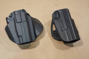 lot 126 image: 2 Molded Poly Handgun Holsters