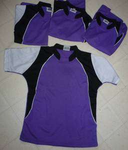 lot 18 image: Four youth size Small black and purple hockey jerseys
