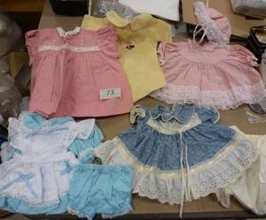 lot 73 image: Group of doll clothes