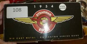 lot 108 image: 1934 Stearman Bi-plane Ford motor co.  SpecCast Die cast 1993 New in box