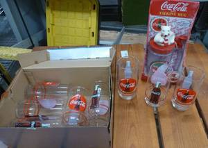 lot 173 image: 8 Coca-Cola glasses and a Talking Mug