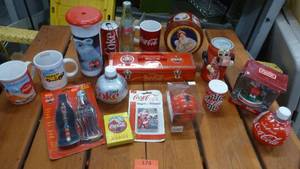 lot 174 image: Coke items - cups, cards, bank, tins, ornaments