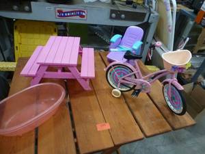 lot 193 image: American Girl picnic table, lounger, bath tub and bicycle